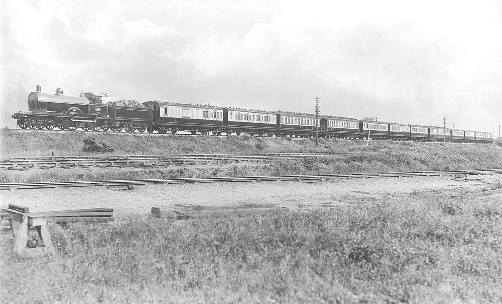 LNWR Precursor class 4-4-0 No 2064 'Jason' stands on the down Northampton line approaching Hillmorton Signal Cabin