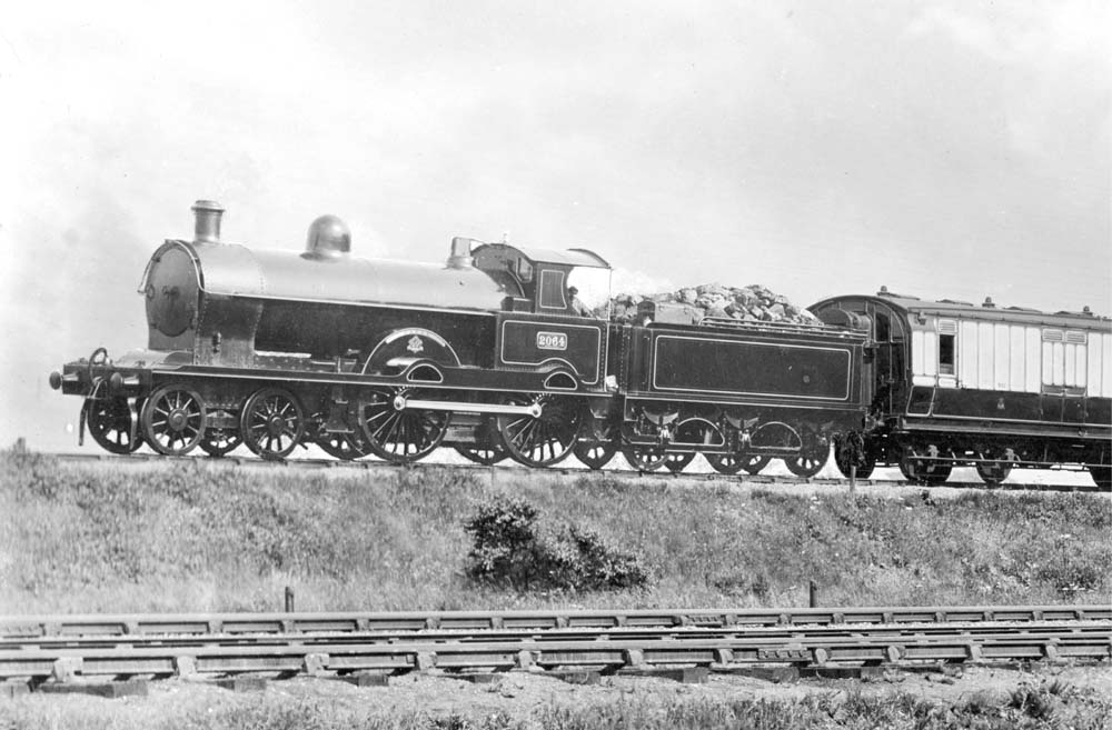 Close up of the above photograph showing No 2064 'Jason' at the head of LNWR corridor stock