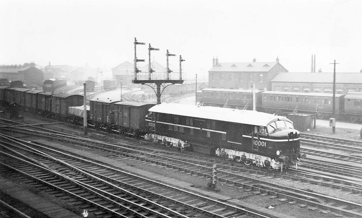 British Railways built 10001, sister engine to LMS 10000, passes by Rugby station's goods yard on a down goods service in 1950