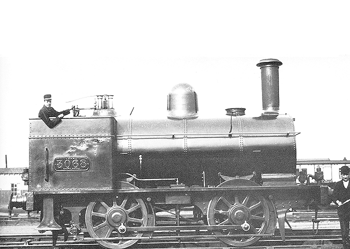 LNWR 0-4-0 Four-foot shunter No 3068 poses for the camera adjacent to the carriage workshops circa 1900