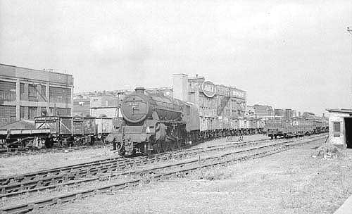 Ex-LMS 4-6-0 Black 5 No 45448 heads a north bound freight train out of the exchange sidings