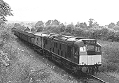 British Railways Sulzer Type 2 Bo-Bo D5137 is seen at the head of a Rugby via Marton to Southam cement works freight service