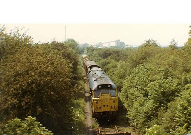 An unidentified Brush Type 2 A1A+A1A diesel locomotive is seen near Southam Cement works circa 1980s