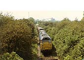 An unidentified Brush Type 2 A1A+A1A diesel locomotive is seen near Southam Cement works circa 1980s
