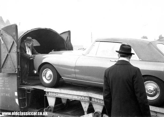Bentley S3 Continental MPW drophead coupe is seen being loaded into the motorail rolling stock