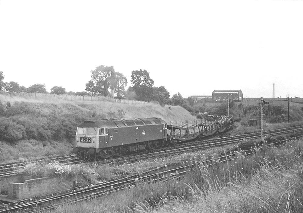 Brush Type 4 1842 with an empty cartic train comes off what became known as the Gosford Green branch on 4th August 1971