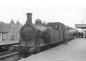 Ex-Midland Railway 1P 0-4-4T No 58083 is seen at Warwick station on a local Leaminton to Nuneaton passenger service in 1950