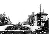 Looking towards Redditch as a Midland Railway goods train is seen passing through the station on a Birmingham to Evesham freight service