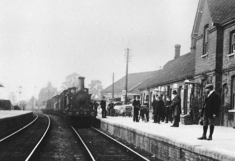 Close up of the Midland Railway Kirtley double framed 0-6-0 locomotive at the head of the goods train passing through the station