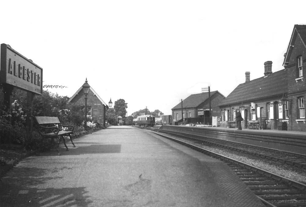 Looking towards Redditch along the up platform with the GWR's Bearley to Alcester branch auto trailer standing in the goods yard