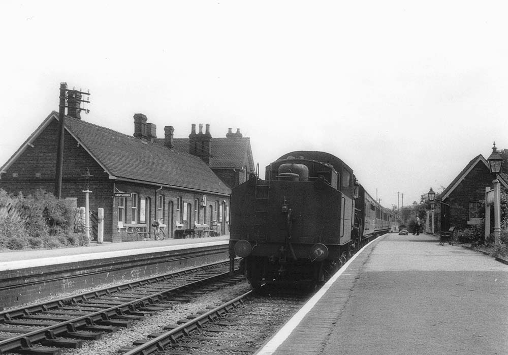 British Railways built Ivatt 4MT Mogul No 43036, running tender first, is seen arriving at Alcester on a local passenger train to Birmingham