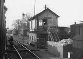 The signalman stretches up to the fireman as they exchange the single line staff in this view taken from a Birmingham bound train