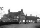External view showing the station approach and station building with the station master's house situated on the left