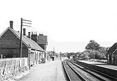 Looking towards Evesham along Alcester's down platform on the left and two wagons stabled in the twelve vehicle siding