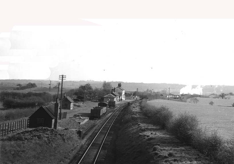 A 1954 view of Alvechurch station looking towards Redditch with several coal wagons stabled on the siding