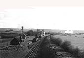 A 1954 view of Alvechurch station looking towards Redditch with several coal wagons stabled on the siding