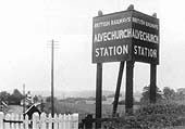 Alvechurch station's road side nameboard sited at the entrance to the station by the overbridge