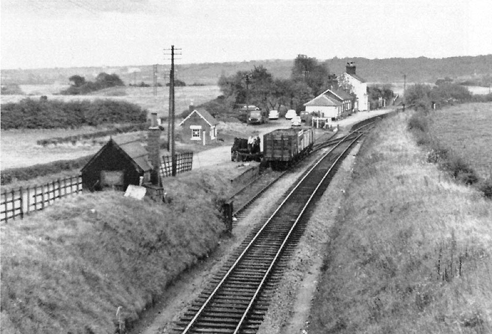 Looking south towards Evesham with on the left coal wagons being unloaded on the single line siding