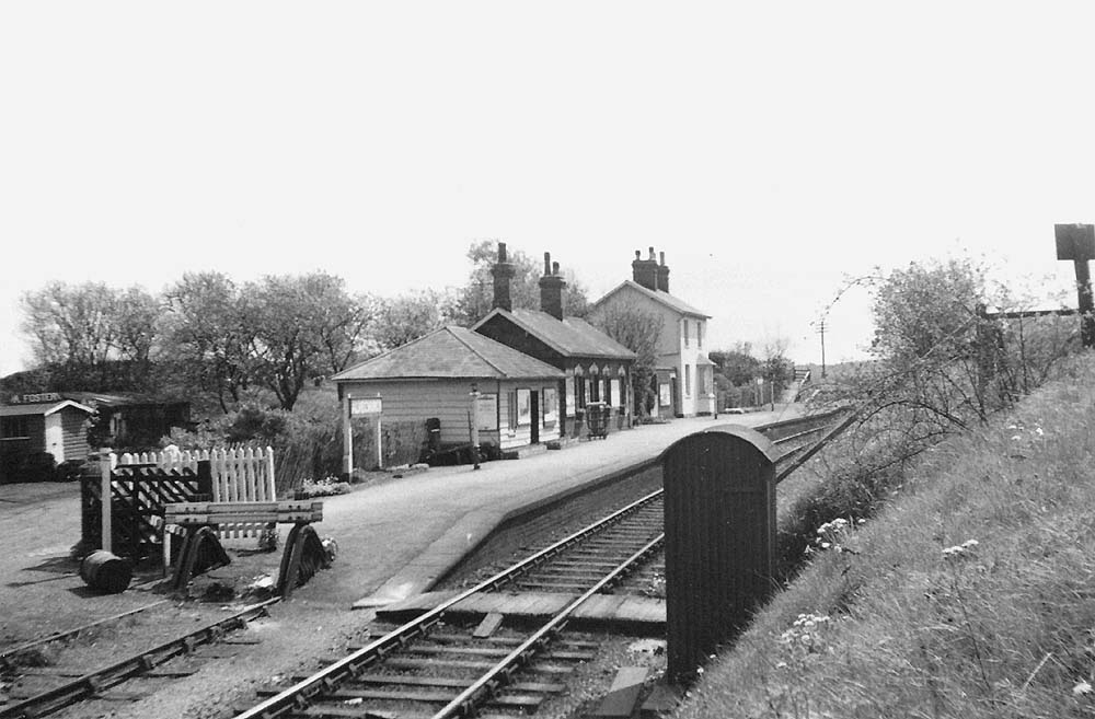 Looking along the station with the siding's buffer stops to the left and the ground frame structure to the right