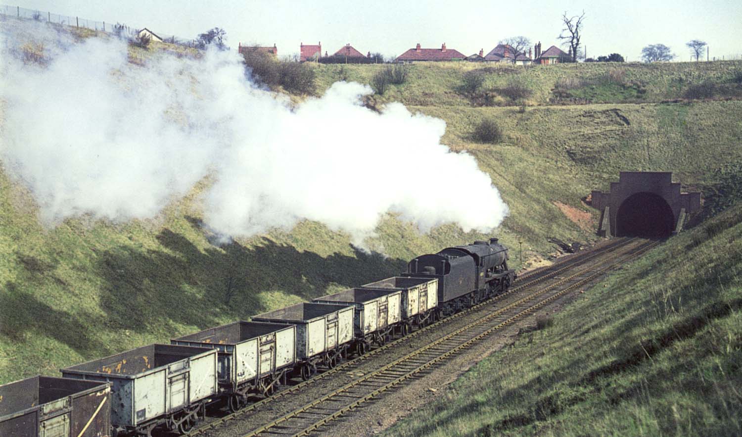 Ex-LMS 8F 2-8-0 No 48111 hauls an empty coal train up the 1 in 125 gradient to Arley Tunnel on 20th March 1966