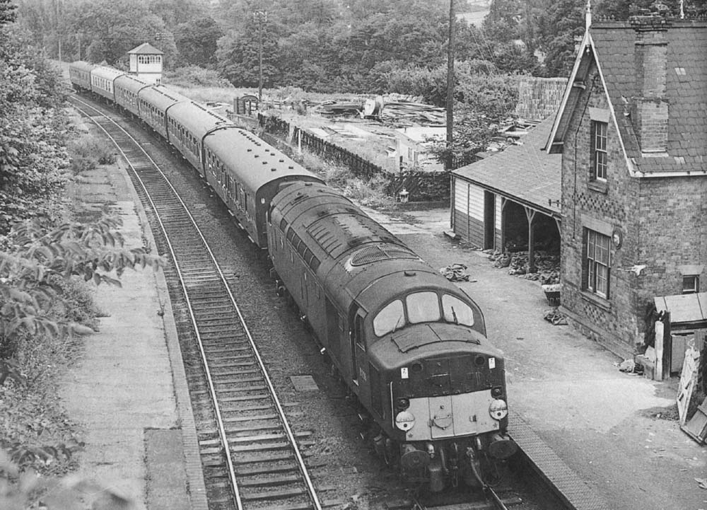 Diesel locomotive D298 is seen passing through the closed station on Sunday 10th July 1966
