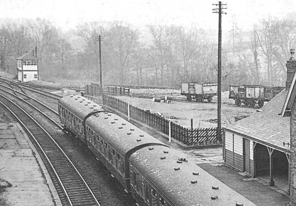 Close up showing some steel bodied open mineral wagons standing on one of the two sidings