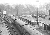 Close up showing some steel bodied open mineral wagons standing on one of the two sidings