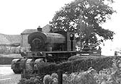 An unidentified Colliery locomotive being transported by low loader outside No 63 Gun Hill Arley