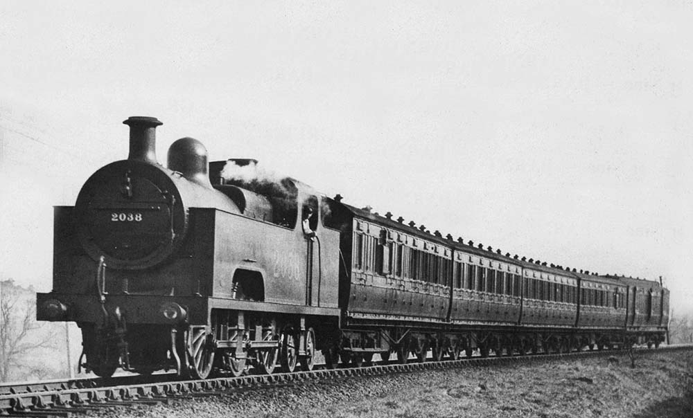 LMS Deeley 0-6-4T 'Flatiron' No 2038 on a Redditch to Birmingham New St local passenger train