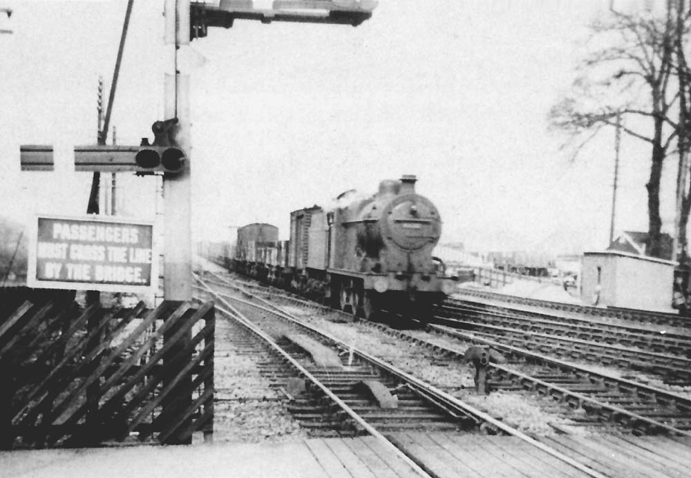 An unidentified ex-MR 0-6-0 4F passes through the junction on the down fast at the head of a Birmingham to Gloucester freight
