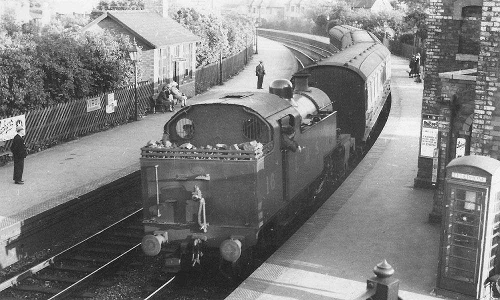 LMS Fowler Class 3P 2-6-2T No 16 is running bunker first on a Redditch to Birmingham New Street train