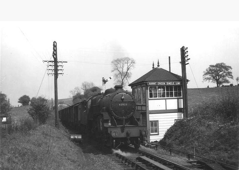 Ex-LMS 2-6-0 'Crab' No 42822 is seen coming off the single line as it passes the Signal Box on 10th May 1954