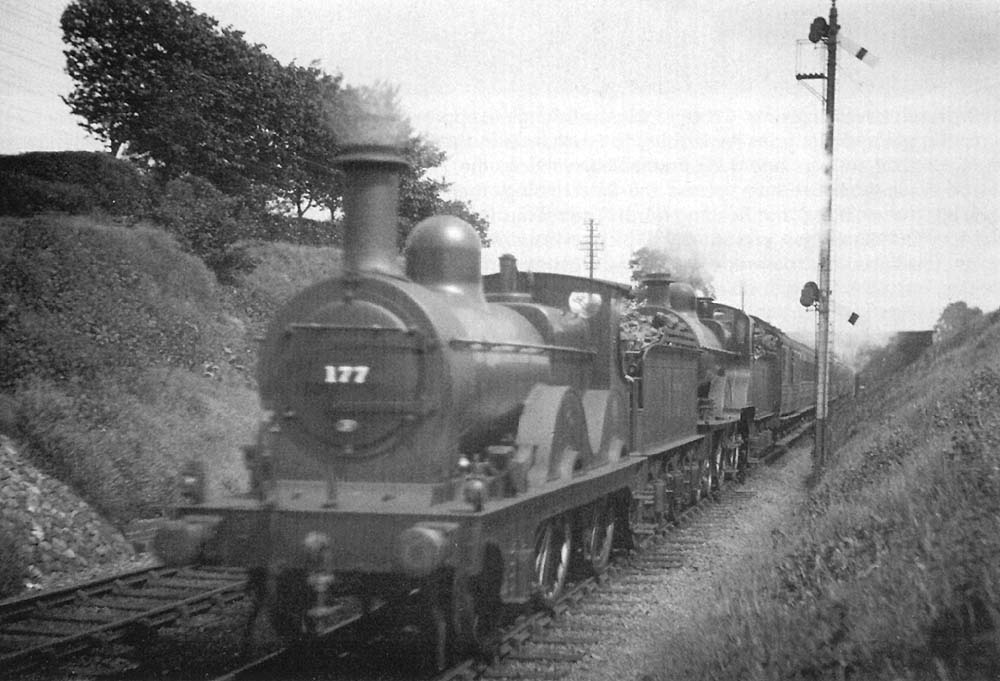 Midland Railway 2-4-0 No 177 pilots to Midland Railway 4-4-0 No 523 as it approaches Barnt Green station