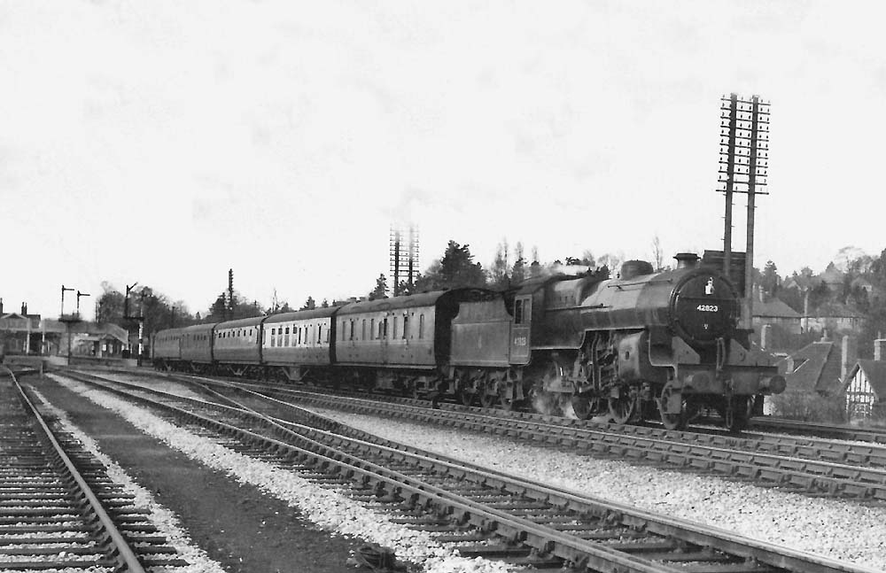 Ex-LMS 2-6-0 No 42823 is seen departing Barnt Green station at the head of a five-coach Gloucester to New Street service