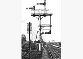 View of Barnt Green station's up main line bracket signal showing the co-acting or repeater signal arms