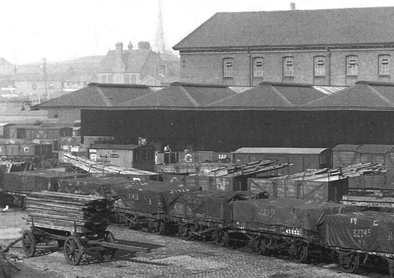 Close up showing the majority of the wagons employed for moving goods were five or seven plank open wagons with tarpaulin covers