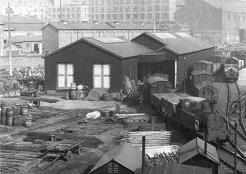 Close up showing the extended timber built 'metal shed' and two-storey stable block