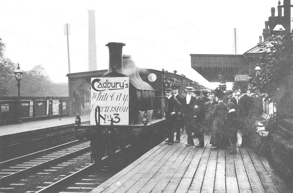 The third excursion train of Cadbury employees to the White City, headed by a Johnson 0-6-0, stands at the up platform