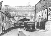 A Cadbury Brothers Scammell 'mechanical horse' passes beneath heavily graffitied Bournville Lane bridge in 1936