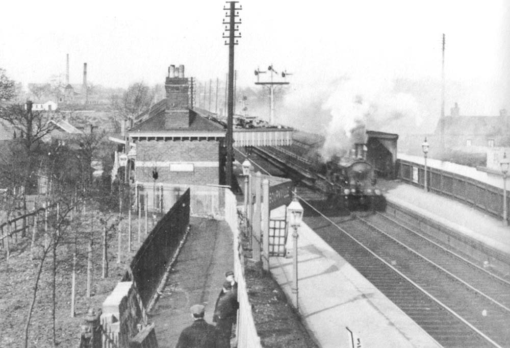 Looking towards New Street from Maryvale Road bridge with the footpath and steps leading to the station in the centre