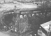 Close up showing Bournville station's booking office and the steps and lift from ground level to the platform