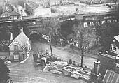 An elevated view showing the station's ground level booking office on the right and Station Lodge on the left