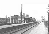 Bournville station, seen through the arch of the bridge carrying Maryvale Road, on Sunday 12th September 1954