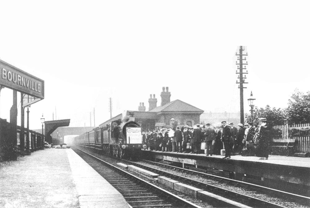 A view of a Cadburys seaside excursion train, standing at the up platform in 1912