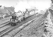Ex-LMS 5MT 4-6-0 No 44842 runs along side the shed at the head of an Ian Allen Special on 16th April 1955