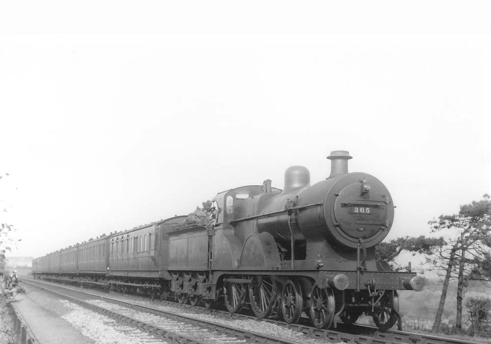 Ex-MR 2P 4-4-0 No 365 is photographed heading a seven coach train near Bournville on Wednesday 2nd October 1929