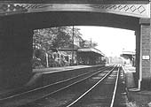 Close up of Bournville station, seen through the arch of the bridge carrying Maryvale Road, looking towards New Street station
