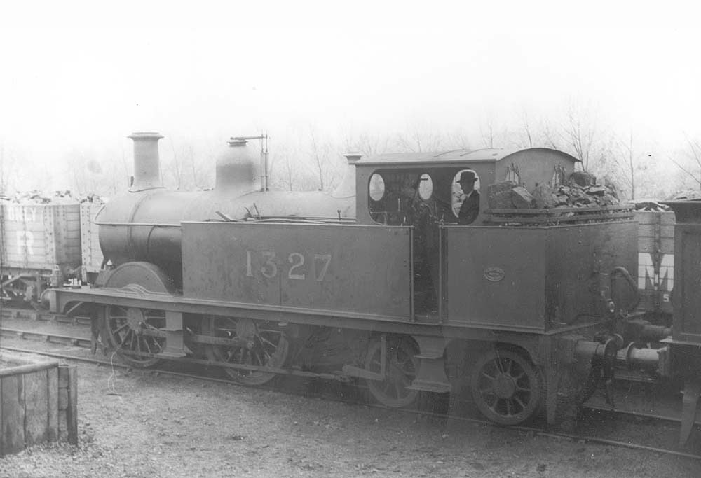 Midland Railway 1P 0-4-4T No 1327, bunker filled with coal for its next trip, stands in a siding at Bournville on Sunday 9th April 1922