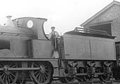 Close up showing the typical dress of a MR fireman in 1919 as well as the type of shovel used