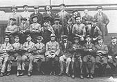 A 1920s photograph showing some members of staff Bournville Shed seated either side of the shed foreman
